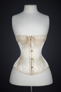 'Stella' Ivory Satin Corset With Flossing Embroidery & Cording by C. T., c. 1900, made in France for the USA market. The Underpinnings Museum. Photography by Tigz Rice.