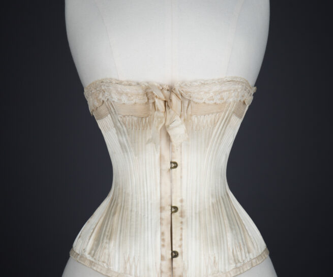 'Stella' Ivory Satin Corset With Flossing Embroidery & Cording by C. T., c. 1900, made in France for the USA market. The Underpinnings Museum. Photography by Tigz Rice.