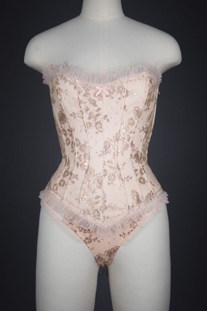 Peach Nylon With Metallic Lace Overlay Corset & Thong by Fifi Chachnil, 1998, France. The Underpinnings Museum. Photography by Tigz Rice.