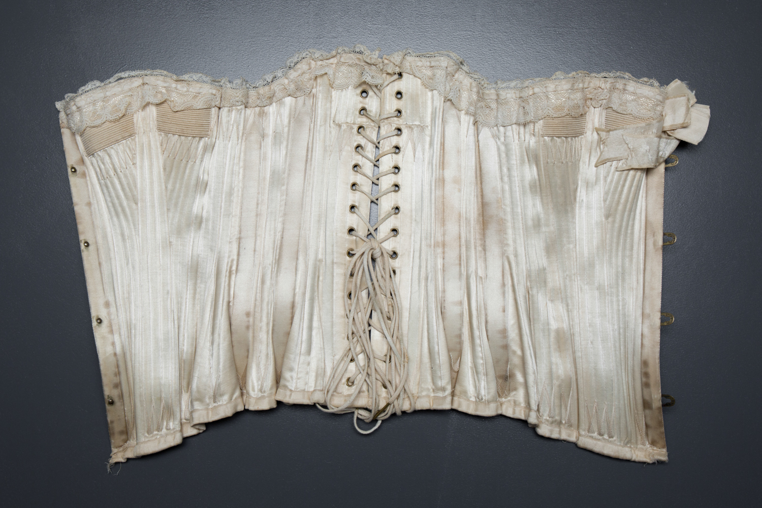 'Stella' Ivory Satin Corset With Flossing Embroidery & Cording by C. T., c. 1900, made in France for the USA market. The Underpinnings Museum. Photography by Tigz Rice.
