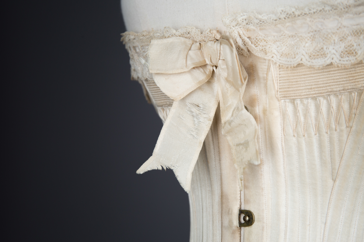 'Stella' Ivory Satin Corset With Flossing Embroidery & Cording by C. T., c. 1900, made in France for the USA market. The Underpinnings Museum. Photography by Tigz Rice.