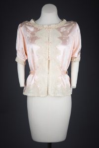 Jacquard Weave Cherry Blossom Silk Bed Jacket With Appliqué & Frog Fastenings, c. 1940s, Made in China for the USA market. The Underpinnings Museum. Photography by Tigz Rice.