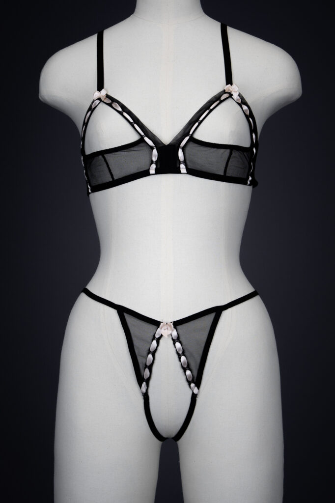 'Leila' Sheer Mesh & Satin Ribbon Slot Sling Bra & Thong By Agent Provocateur, 2005, France. The Underpinnings Museum. Photography by Tigz Rice 'Leila' Sheer Mesh & Satin Ribbon Slot Sling Bra & Thong By Agent Provocateur, 2005, France. The Underpinnings Museum. Photography by Tigz Rice