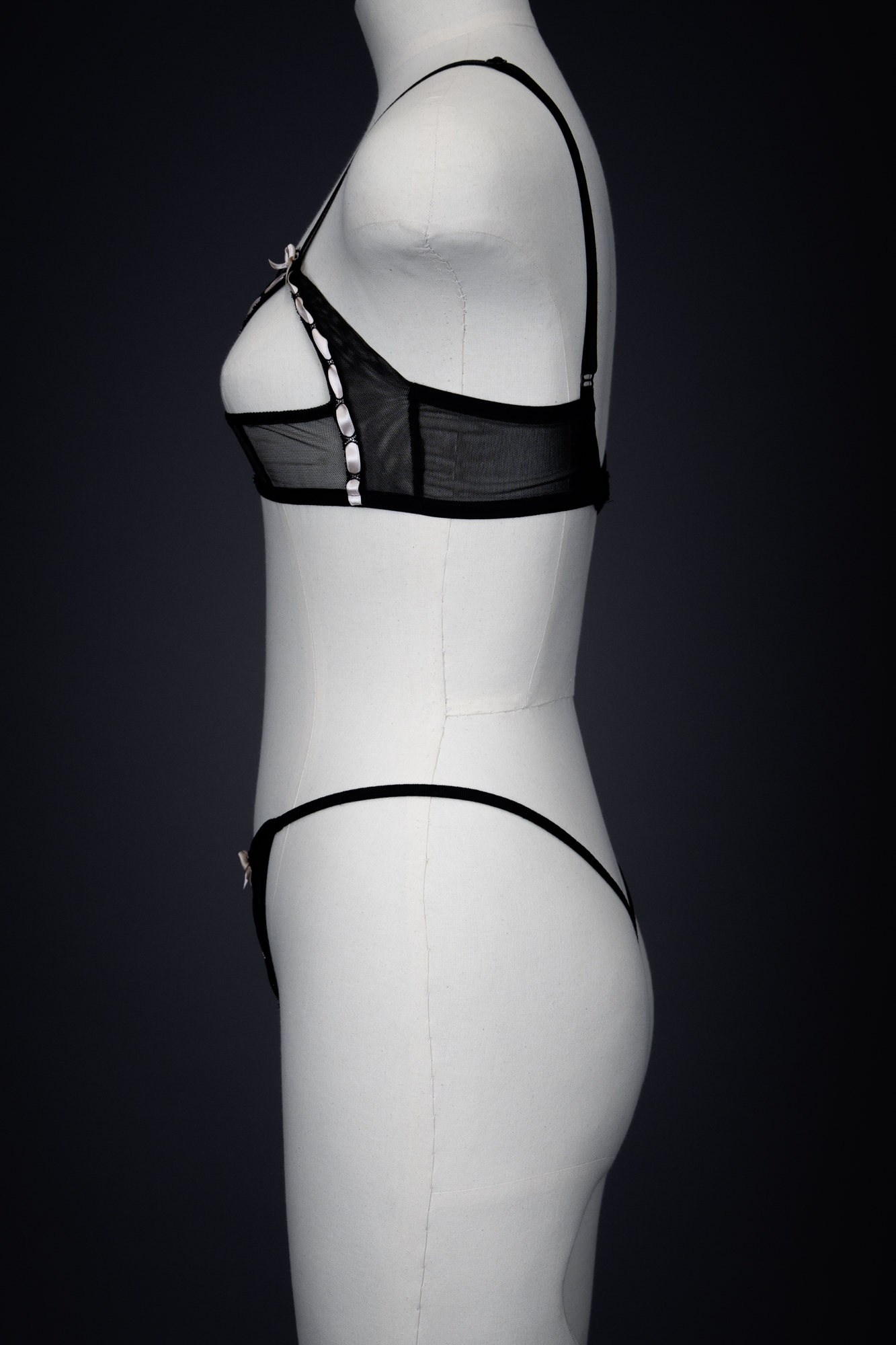 'Leila' Sheer Mesh & Satin Ribbon Slot Sling Bra & Thong By Agent Provocateur, 2005, France. The Underpinnings Museum. Photography by Tigz Rice 'Leila' Sheer Mesh & Satin Ribbon Slot Sling Bra & Thong By Agent Provocateur, 2005, France. The Underpinnings Museum. Photography by Tigz Rice