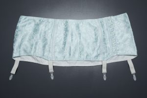 Homemade Pale Blue Jacquard Weave Suspender Belt With Plastic Garter Clips, c. 1950s, Russia. The Underpinnings Museum. Photography by Tigz Rice.