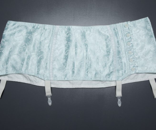 Homemade Pale Blue Jacquard Weave Suspender Belt With Plastic Garter Clips, c. 1950s, Russia. The Underpinnings Museum. Photography by Tigz Rice.