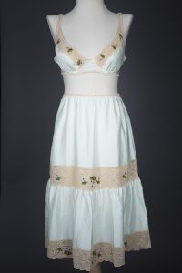 Embroidered Lace & Polyester Satin Bra & Half Slip Set By Janet Reger, c. 1970s, Great Britain. The Underpinnings Museum. Photography by Tigz Rice.