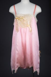 Pink Silk Step In Teddy With Lace Appliqué & Ribbonwork, c. 1920s, USA. The Underpinnings Museum. Photography by Tigz Rice