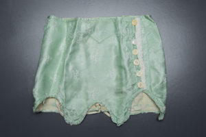Short Green Brocade Girdle, c. 1920s, Russia. The Underpinnings Museum. Photography by Tigz Rice