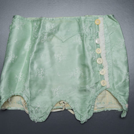 Short Green Brocade Girdle, c. 1920s, Russia. The Underpinnings Museum. Photography by Tigz Rice