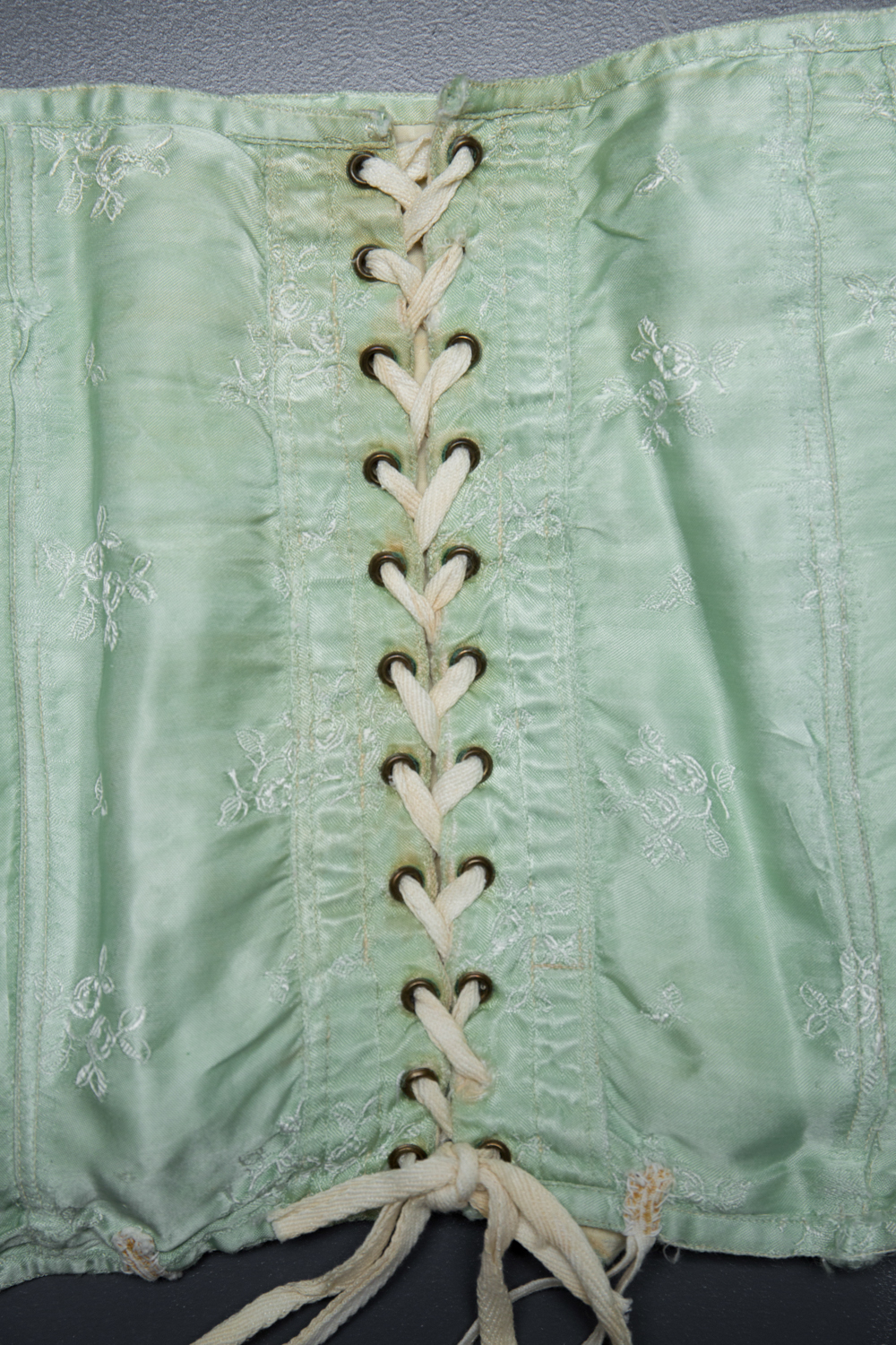 Short Green Brocade Girdle, c. 1920s, Russia. The Underpinnings Museum. Photography by Tigz Rice