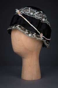 Black Silk Boudoir Cap With Machine Embroidered Trim & Ribbonwork, c. 1930s, Great Britain. The Underpinnings Museum. Photography by Tigz Rice