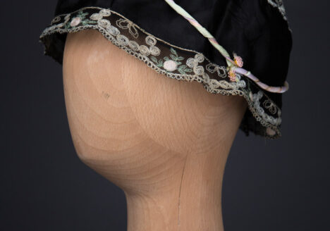 Black Silk Boudoir Cap With Machine Embroidered Trim & Ribbonwork, c. 1930s, Great Britain. The Underpinnings Museum. Photography by Tigz Rice