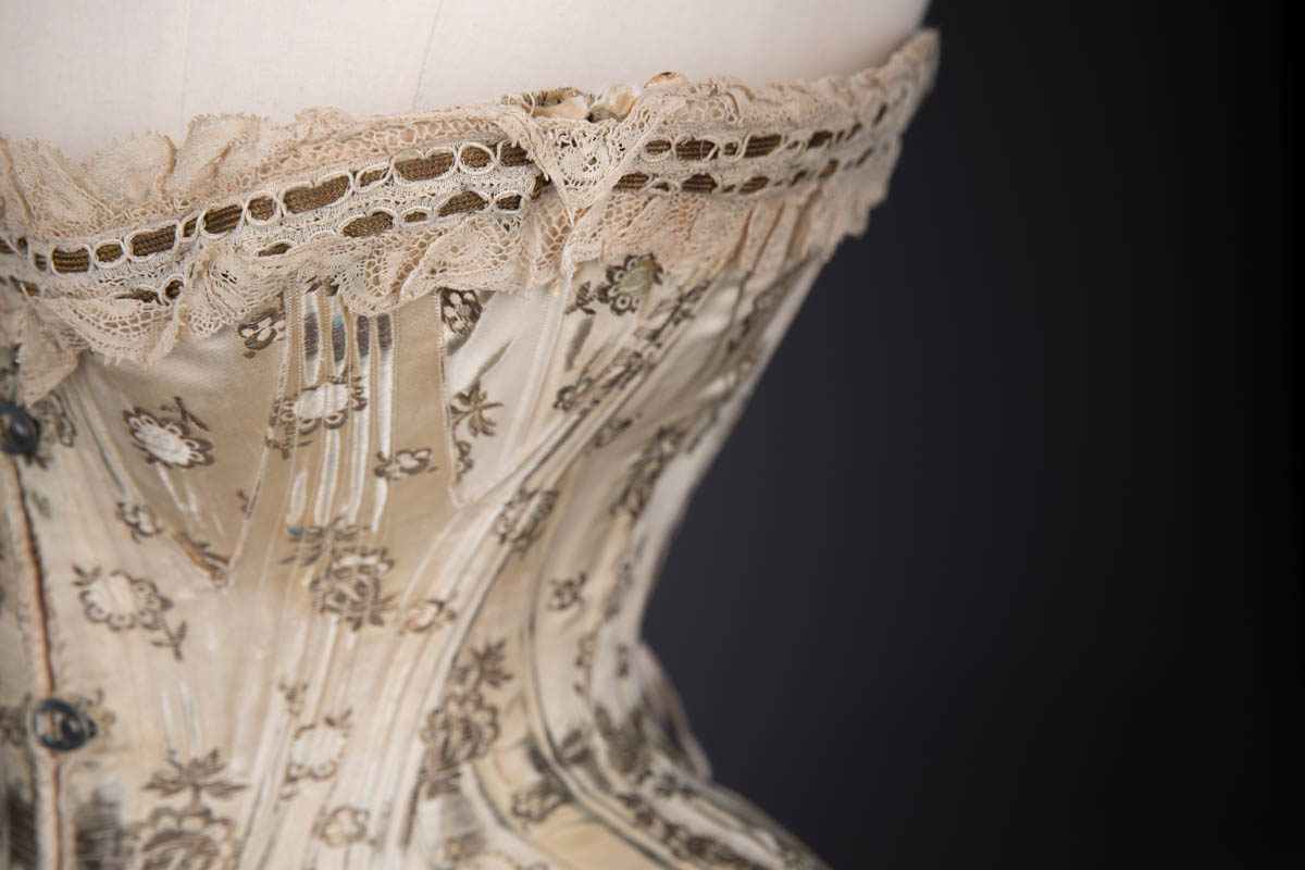 Corset of silk, edged with machine-made lace, reinforced with whalebone and  metal eyelets, cotton twill li…
