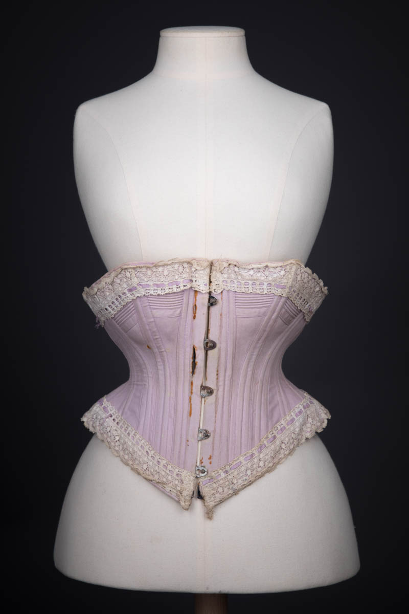 Lilac Herringbone Coutil Corset With Ribbon Slot Lace Trim, c. 1890s, possibly France. The Underpinnings Museum. Photography by Tigz Rice