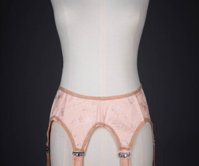 Tea Rose Floral Brocade Suspender With Ruffled Straps, c. 1920s, USA. The Underpinnings Museum. Photography by Tigz Rice.