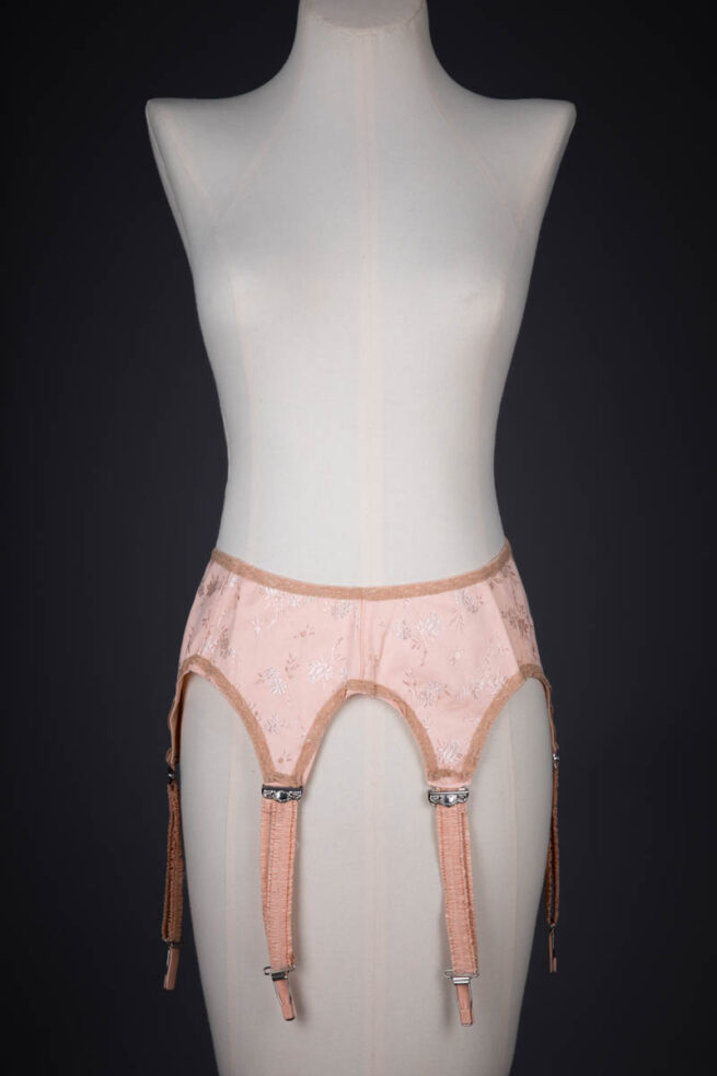 Tea Rose Floral Brocade Suspender With Ruffled Straps, c. 1920s, USA. The Underpinnings Museum. Photography by Tigz Rice.
