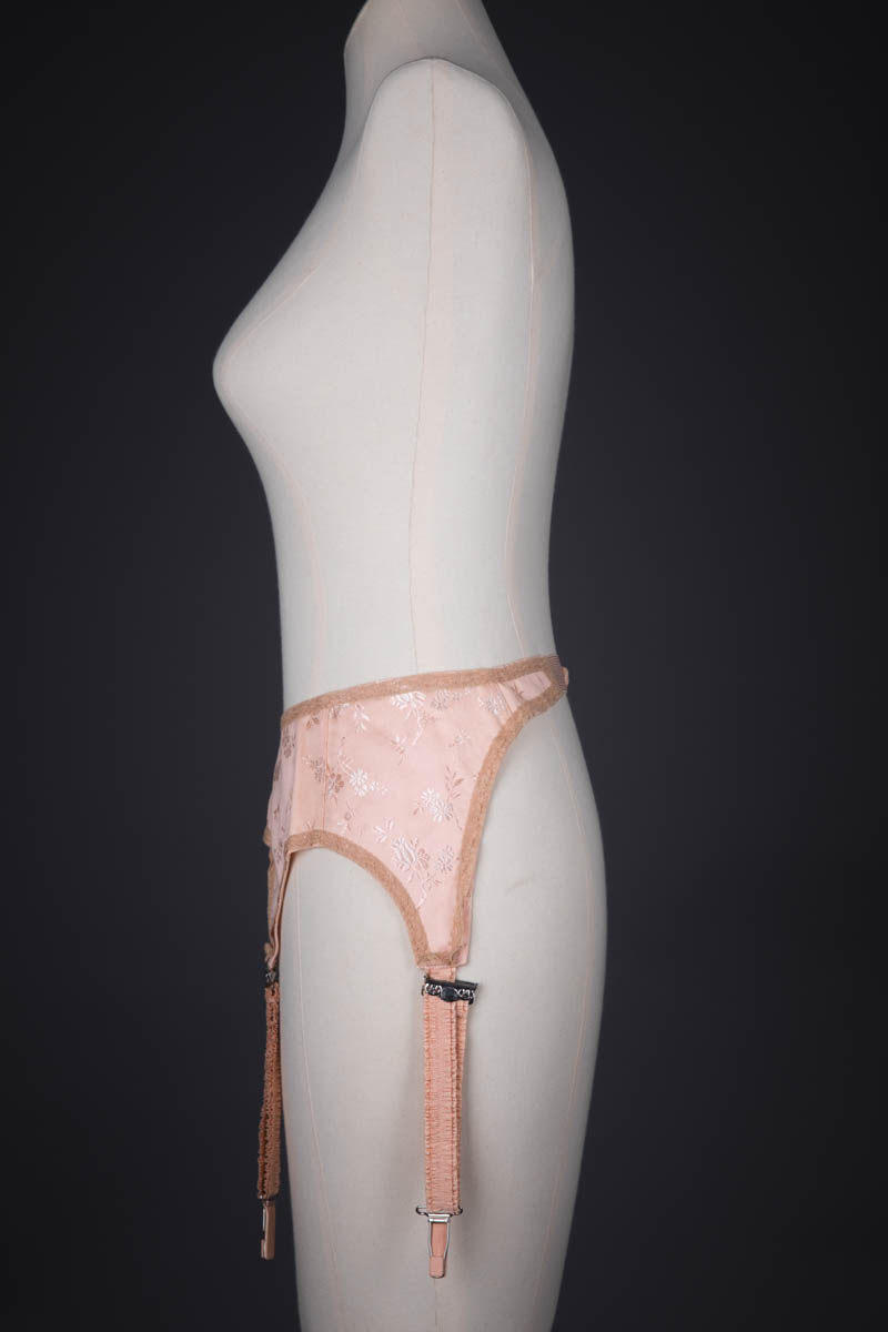 Tea Rose Floral Brocade Suspender With Ruffled Straps, c. 1920s, USA. The Underpinnings Museum. Photography by Tigz Rice.