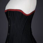 Black Cotton Sateen Corded Corset With Woven Trim, c. 1890s, Great Britain. The Underpinnings Museum. Photography by Tigz Rice.