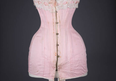 Pink Cotton Twill Longline Corset With Ribbonslot Lace Trim, c. 1910s, France. The Underpinnings Museum. Photography by Tigz Rice