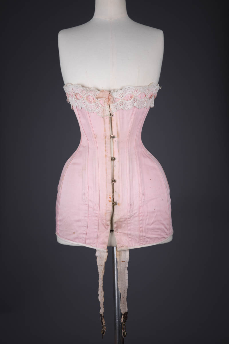 Pink Cotton Twill Longline Corset With Ribbonslot Lace Trim, c. 1910s, France. The Underpinnings Museum. Photography by Tigz Rice
