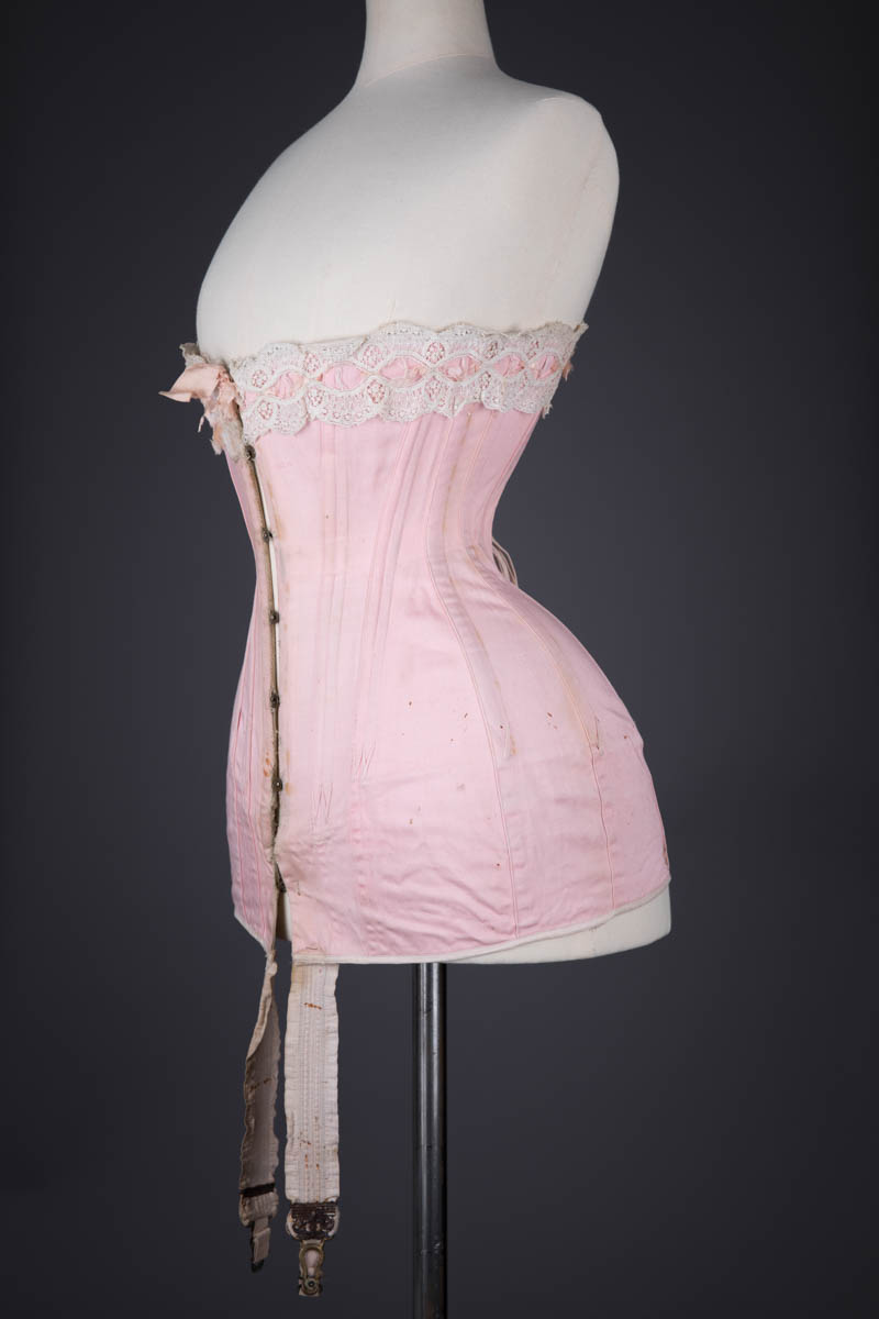Pink Cotton Twill Longline Corset With Ribbon Slot Lace Trim, c. 1910s, France. The Underpinnings Museum. Photography by Tigz Rice