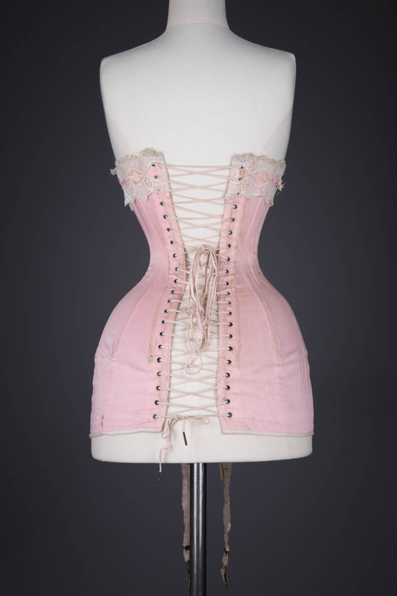 Pink Cotton Twill Longline Corset With Ribbon Slot Lace Trim, c. 1910s, France. The Underpinnings Museum. Photography by Tigz Rice