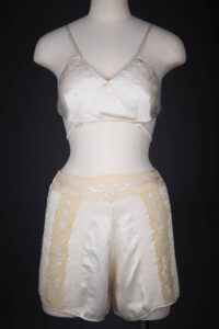 Ivory Silk Satin Embroidered Kestos Style Bra & Appliquéd Tap Pants, c. 1930s, Great Britain. The Underpinnings Museum. Photography by Tigz Rice