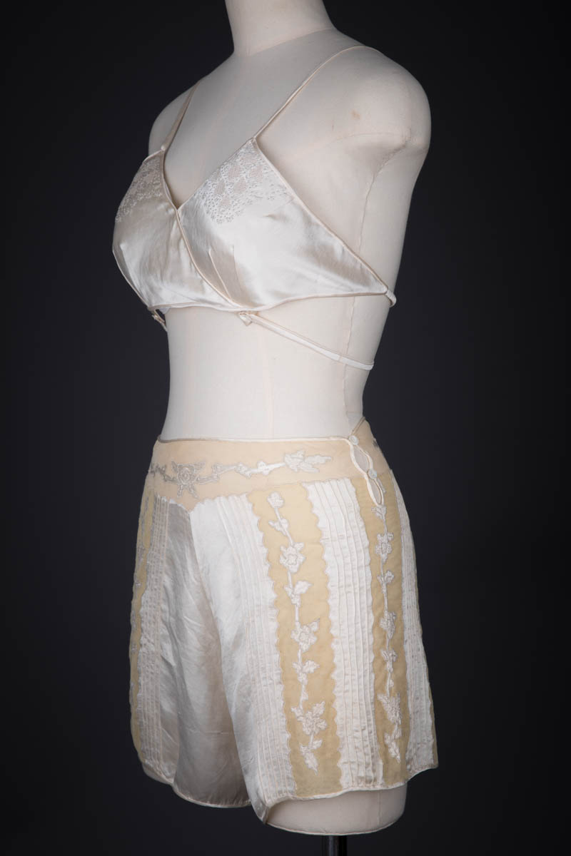 Ivory Silk Satin Embroidered Kestos Style Bra & Appliquéd Tap Pants, c. 1930s, Great Britain. The Underpinnings Museum. Photography by Tigz Rice