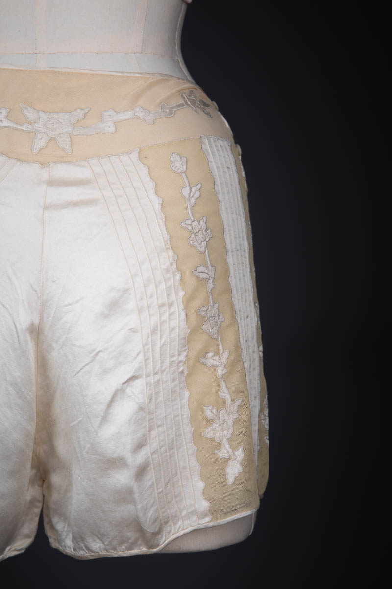 Ivory Silk Satin Embroidered Kestos Style Bra & Appliquéd Tap Pants, c. 1930s, Great Britain. The Underpinnings Museum. Photography by Tigz Rice