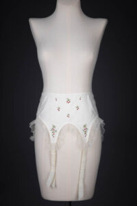 Cherry Embroidered Nylon Suspender Belt By Cadolle, c. 1950s, France. The Underpinnings Museum. Photography by Tigz Rice