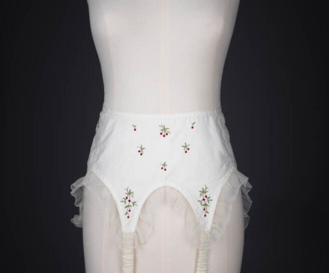 Cherry Embroidered Nylon Suspender Belt By Cadolle, c. 1950s, France. The Underpinnings Museum. Photography by Tigz Rice