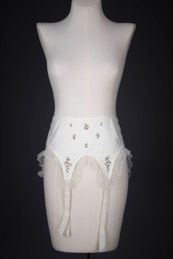 Cherry Embroidered Nylon Suspender Belt By Cadolle, c. 1950s, France. The Underpinnings Museum. Photography by Tigz Rice