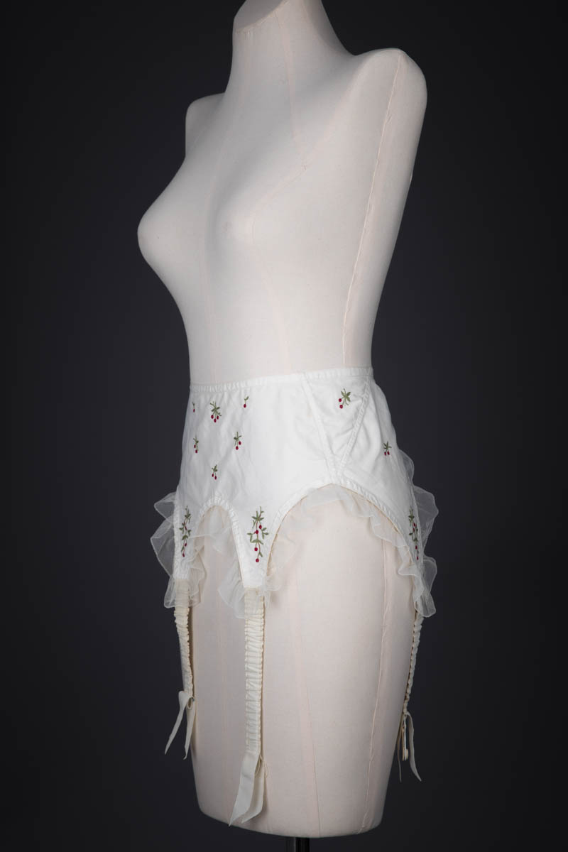 Cherry Embroidered Nylon Suspender Belt By Cadolle, c. 1950s, France. The Underpinnings Museum. Photography by Tigz Rice