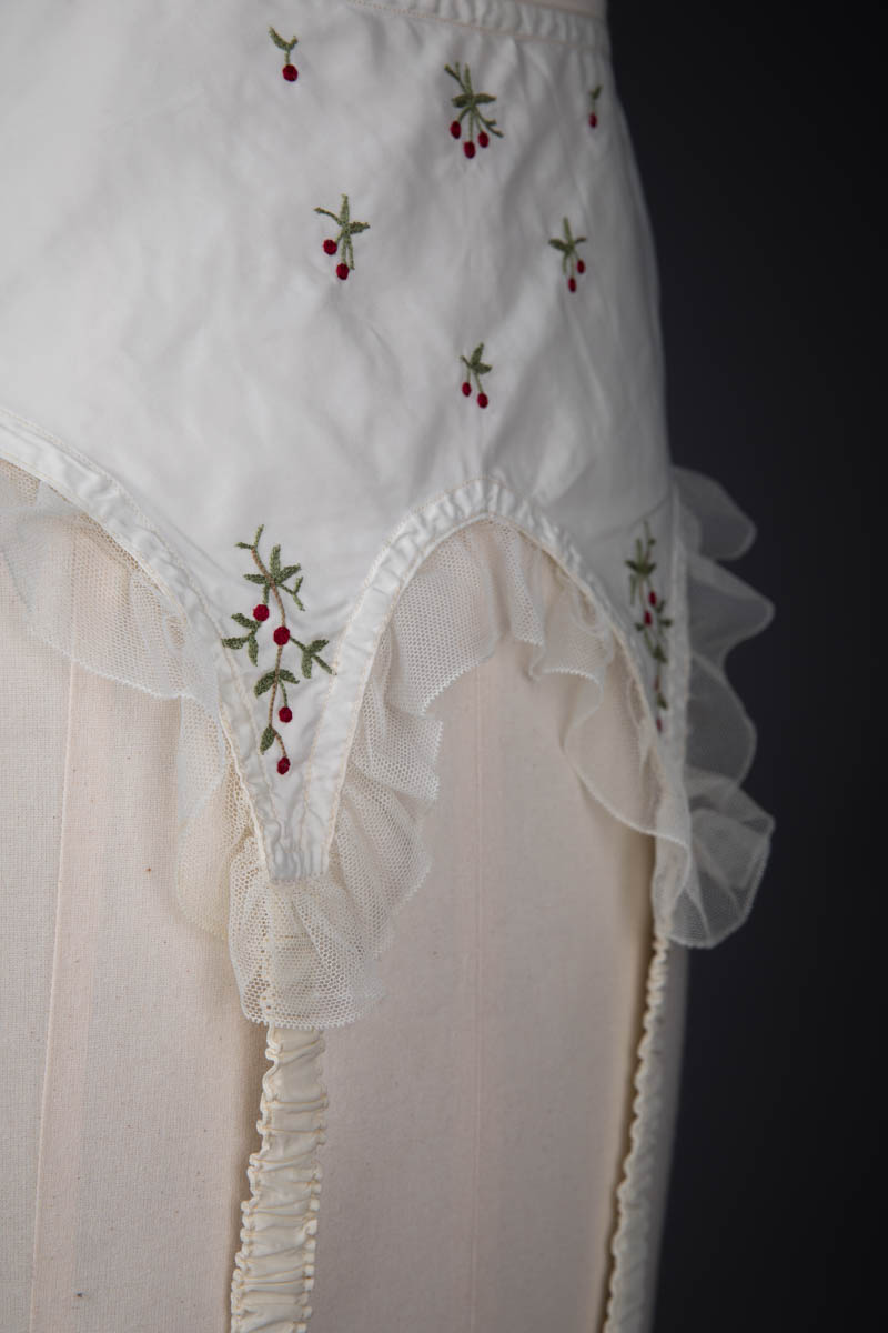 Cherry Embroidered Nylon Suspender Belt By Cadolle, c. 1950s, France. The Underpinnings Museum. Photography by Tigz Rice