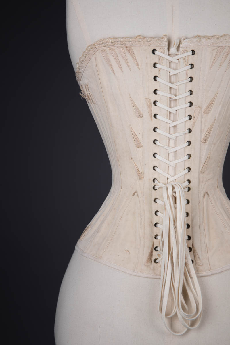 Cotton Twill Straight Front Corset With Corded Bust & Flossing Embroidery, c. 1890s, France. The Underpinnings Museum. Photography By Tigz Rice.