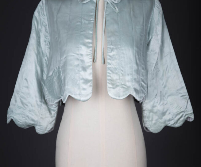 Satin Scalloped Hem Quilted Bed Jacket, c. 1940s, Great Britian. The Underpinnings Museum. Photography by Tigz Rice