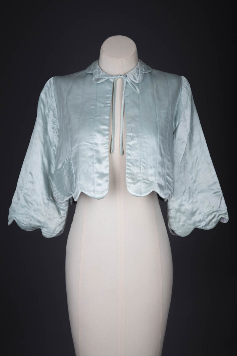 Satin Scalloped Hem Quilted Bed Jacket, c. 1940s, Great Britian. The Underpinnings Museum. Photography by Tigz Rice
