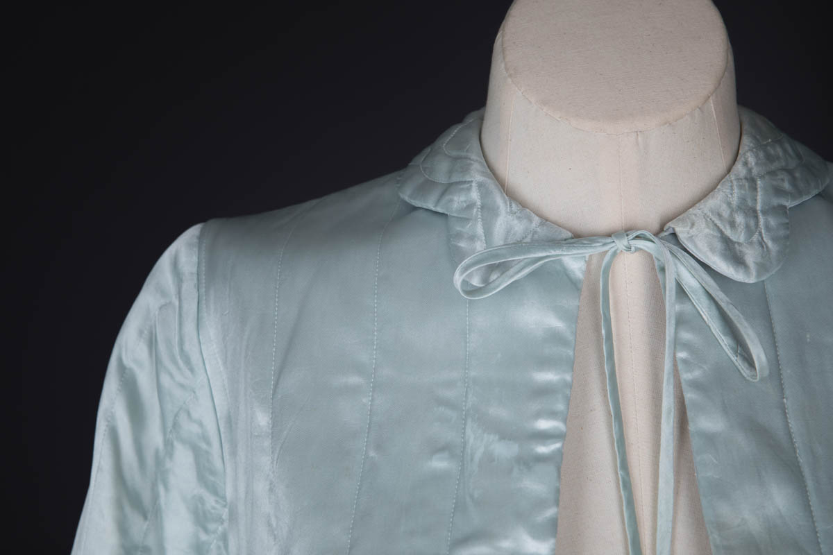 Satin Scalloped Hem Quilted Bed Jacket, c. 1940s, Great Britian. The Underpinnings Museum. Photography by Tigz Rice