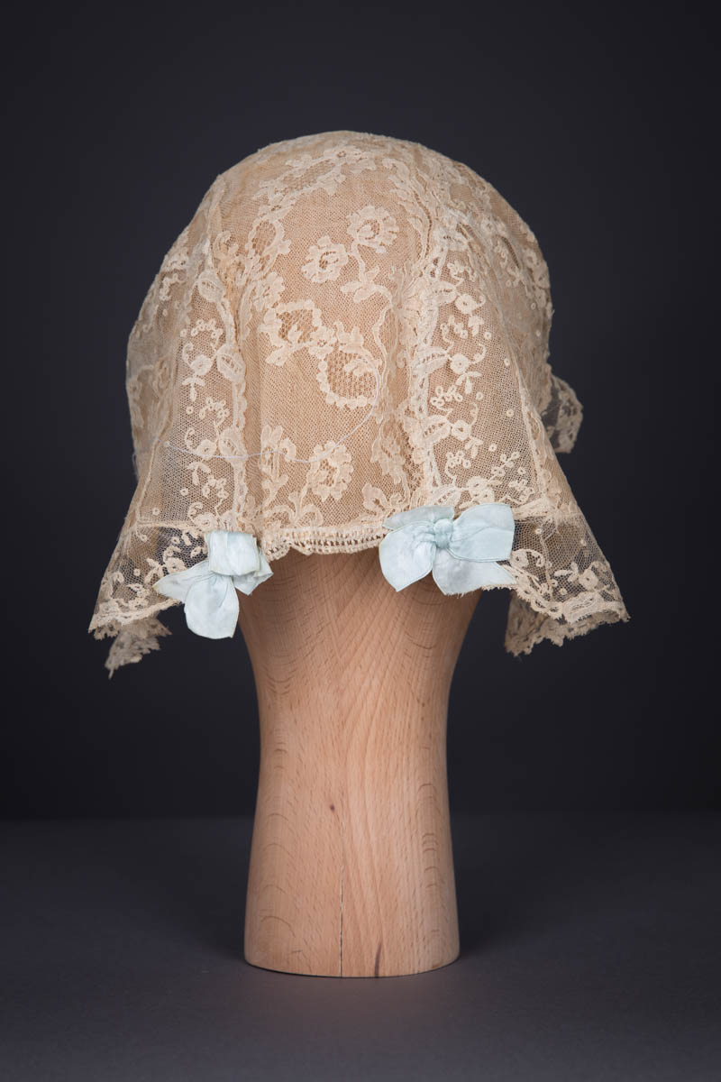 Ecru Machine Lace & Pale Blue Silk Ribbon Boudoir Cap, c. 1920s. The Underpinnings Museum. Photography by Tigz Rice