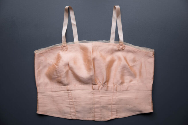 Pink Silk Bandeau Bra By Cadolle, c. 1920s, France. The Underpinnings Museum. Photography by Tigz Rice