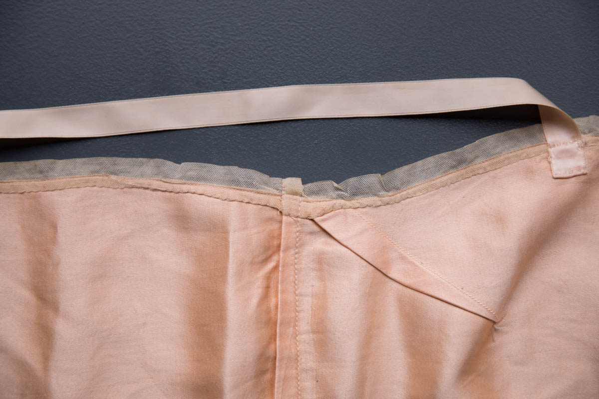 Pink Silk Bandeau Bra By Cadolle, c. 1920s, France. The Underpinnings Museum. Photography by Tigz Rice