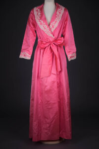 Bright Pink Silk Dressing Gown With Hand Stitched Lace Appliqué By Juel Park, c. 1950s, United States. The Underpinnings Museum. Photography by Tigz Rice