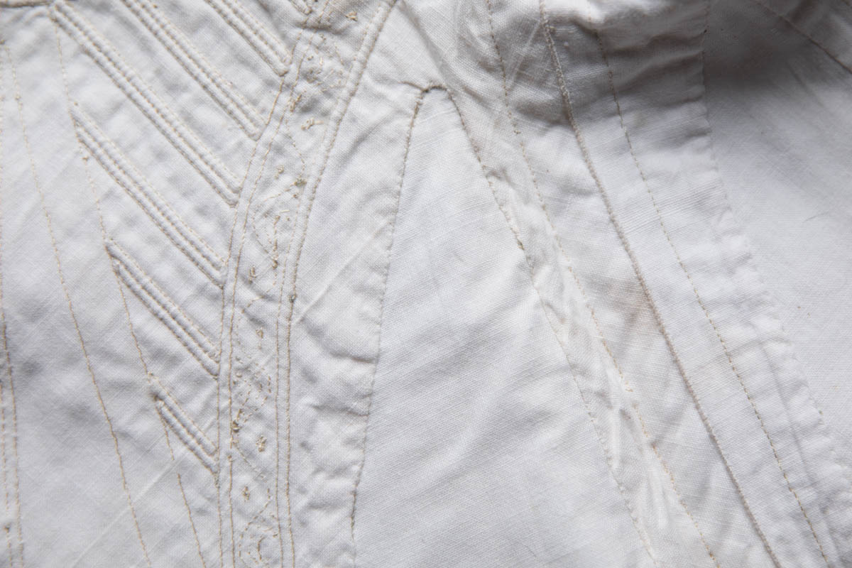 Hand Stitched, Corded & Embroidered White Cotton Corset, c. 1830-1840s. The Underpinnings Museum. Photography by Tigz Rice