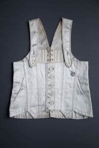Ice Blue Rayon Satin Child's Corset, c. 1930s, USA. The Underpinnings Museum. Photography by Tigz Rice
