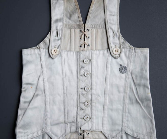Ice Blue Rayon Satin Child's Corset, c. 1930s, USA. The Underpinnings Museum. Photography by Tigz Rice