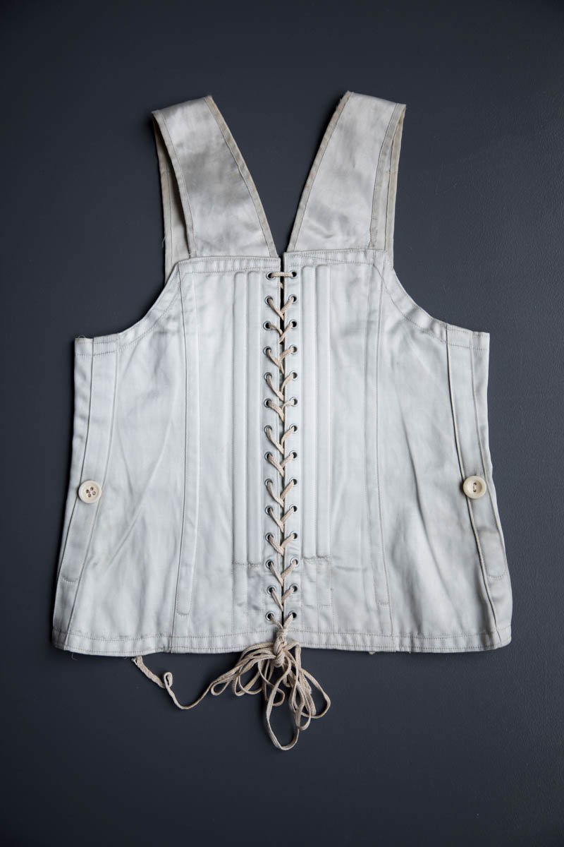 Ice Blue Rayon Satin Child's Corset, c. 1930s, USA. The Underpinnings Museum. Photography by Tigz Rice