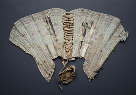 Silk Brocade Midbust Corset With Ribbon Slot Crochet Lace Trim, c. 1900s. The Underpinnings Museum. Photography by Tigz Rice