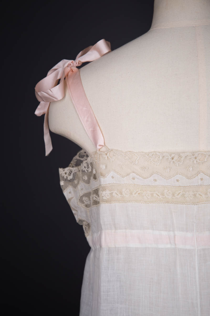 Pleated Cotton Slip With Moon Embroidery, Lace Trim & Silk Ribbon Straps, c. 1910s, Great Britain. The Underpinnings Museum. Photography by Tigz Rice.