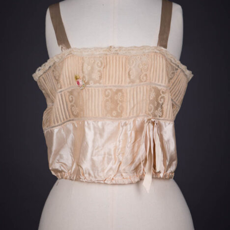 Peach Silk Satin, Pintucked Silk Georgette, Insertion Lace & Ribbonwork Corset Cover By Chamberlin-Johnson-DuBose Co., c. 1920s, USA. The Underpinnings Museum. Photography by Tigz Rice.